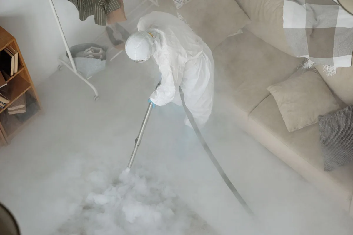 Biohazard cleanup technician in protective equipment, Windham, OH